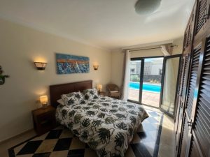 Casa Del Sol master bedroom with pool view 1